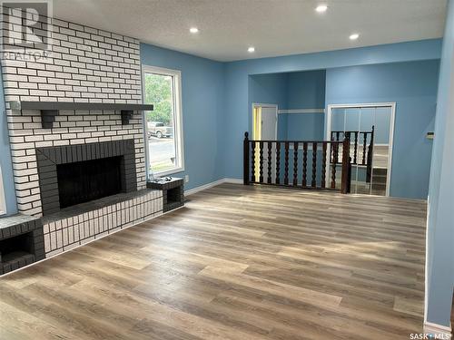 246 Hastings Crescent, Regina, SK - Indoor Photo Showing Living Room With Fireplace