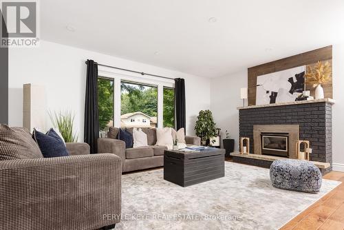 100 Meadow Heights Drive, Bracebridge, ON - Indoor Photo Showing Living Room With Fireplace