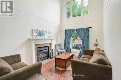 59 - 1100 Byron Baseline Road, London, ON - Indoor Photo Showing Living Room With Fireplace