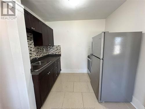 1250 Ouellette Unit# 203, Windsor, ON - Indoor Photo Showing Kitchen With Double Sink