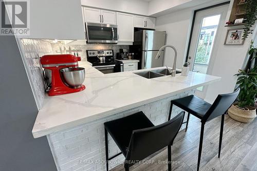 417 - 130 Widdicombe Hill Boulevard, Toronto, ON - Indoor Photo Showing Kitchen With Double Sink