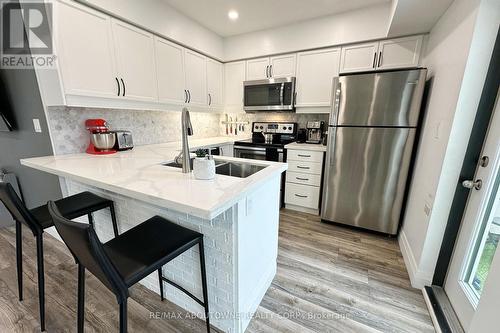 417 - 130 Widdicombe Hill Boulevard, Toronto, ON - Indoor Photo Showing Kitchen With Double Sink With Upgraded Kitchen