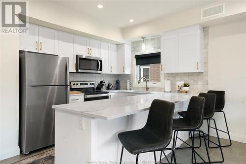 233 Watson Unit# 205, Windsor, ON - Indoor Photo Showing Kitchen With Stainless Steel Kitchen With Double Sink