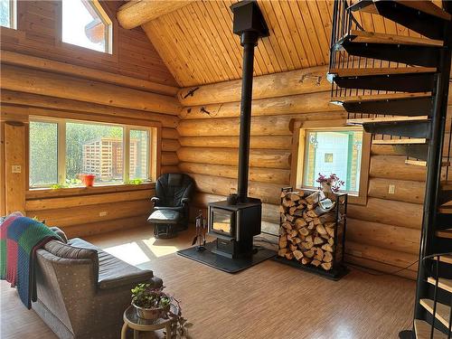 530 Goldeneye Lane, Swan River, MB - Indoor Photo Showing Living Room With Fireplace