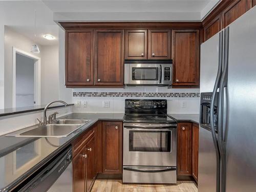 405-1335 Bear Mountain Pkwy, Langford, BC - Indoor Photo Showing Kitchen With Double Sink