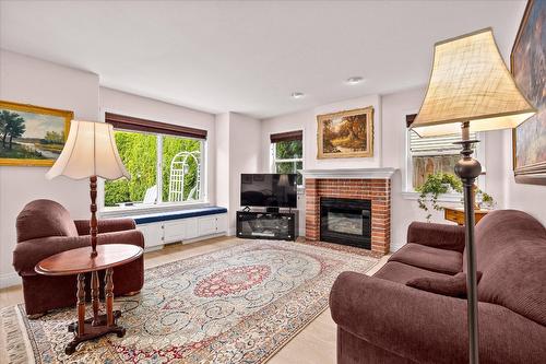 138 Millard Place, Kelowna, BC - Indoor Photo Showing Living Room With Fireplace