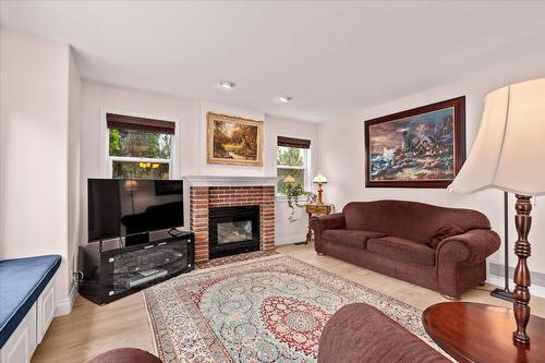 138 Millard Place, Kelowna, BC - Indoor Photo Showing Living Room With Fireplace