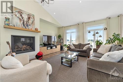 Main floor Living room - 3010 Torwood Drive, Dunrobin, ON - Indoor Photo Showing Living Room With Fireplace