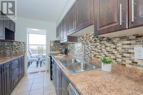 322 - 1050 Stainton Drive, Mississauga, ON - Indoor Photo Showing Kitchen With Double Sink