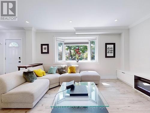 Main - 657 Pharmacy Avenue, Toronto, ON - Indoor Photo Showing Living Room With Fireplace