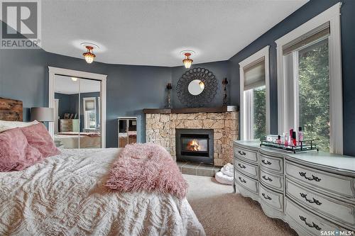 414 Charlebois Court, Saskatoon, SK - Indoor Photo Showing Bedroom With Fireplace