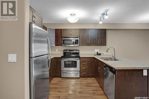 213 2341 Windsor Park Road, Regina, SK - Indoor Photo Showing Kitchen With Stainless Steel Kitchen With Double Sink