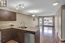 213 2341 Windsor Park Road, Regina, SK  - Indoor Photo Showing Kitchen With Double Sink 