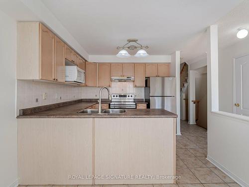 113-5530 Glen Erin Dr, Mississauga, ON - Indoor Photo Showing Kitchen With Double Sink