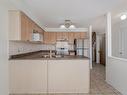 113-5530 Glen Erin Dr, Mississauga, ON  - Indoor Photo Showing Kitchen With Double Sink 