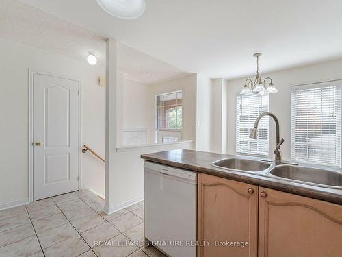 113-5530 Glen Erin Dr, Mississauga, ON - Indoor Photo Showing Kitchen With Double Sink