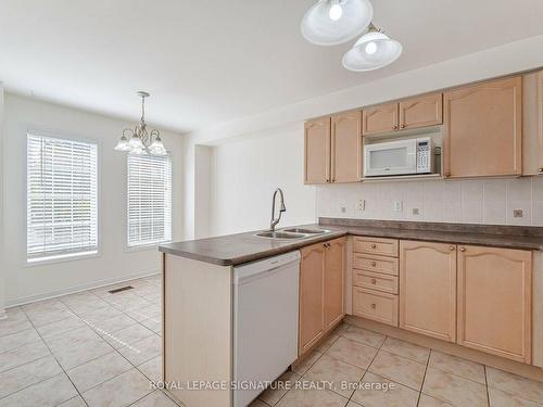 113-5530 Glen Erin Dr, Mississauga, ON - Indoor Photo Showing Kitchen With Double Sink