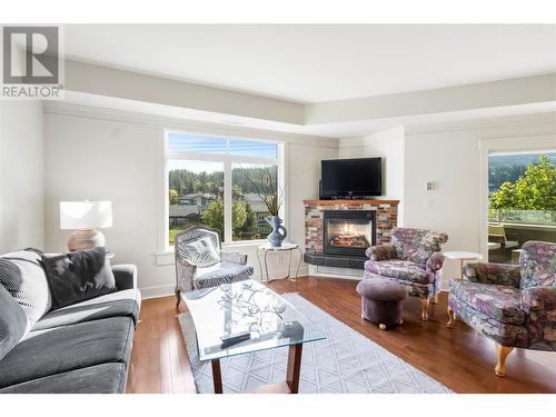 611 Shuswap Street Sw Unit# 103, Salmon Arm, BC - Indoor Photo Showing Living Room With Fireplace