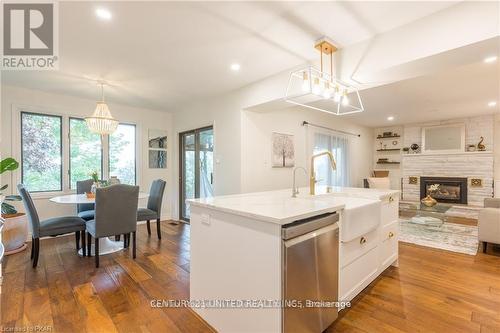 1006 Golfview Road, Peterborough (Monaghan), ON - Indoor Photo Showing Dining Room With Fireplace