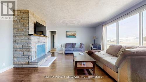 7811 Highway 89, Adjala-Tosorontio, ON - Indoor Photo Showing Living Room With Fireplace