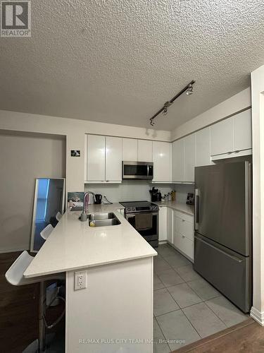 423 - 50 Thomas Riley Road, Toronto, ON - Indoor Photo Showing Kitchen With Stainless Steel Kitchen With Double Sink