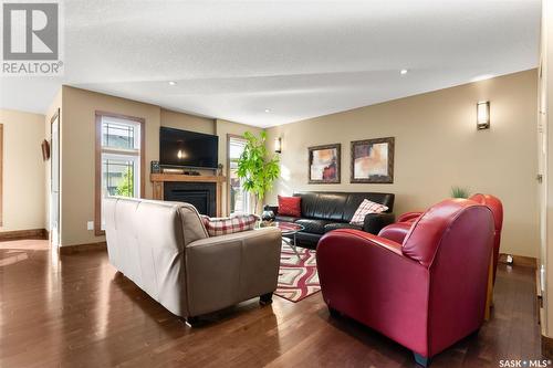 3605 Green Cedar Court, Regina, SK - Indoor Photo Showing Living Room With Fireplace