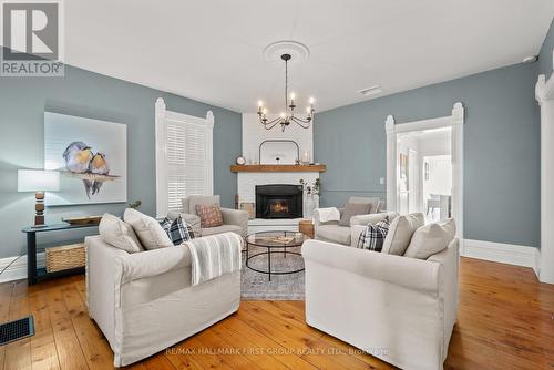 7823 Bickle Hill Road, Hamilton Township, ON - Indoor Photo Showing Living Room With Fireplace