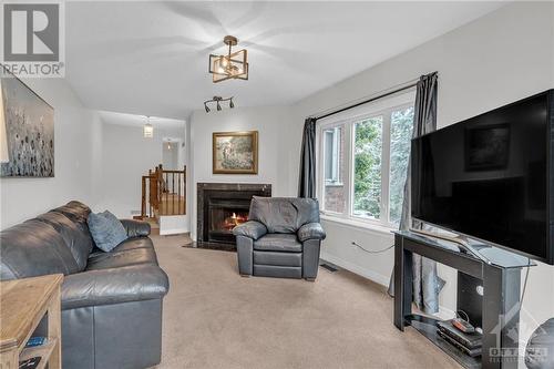 73 Winnegreen Court, Ottawa, ON - Indoor Photo Showing Living Room With Fireplace