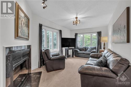 73 Winnegreen Court, Ottawa, ON - Indoor Photo Showing Living Room With Fireplace