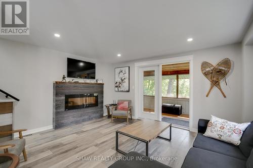 1258 Dwight Beach Road, Lake Of Bays, ON - Indoor Photo Showing Living Room With Fireplace