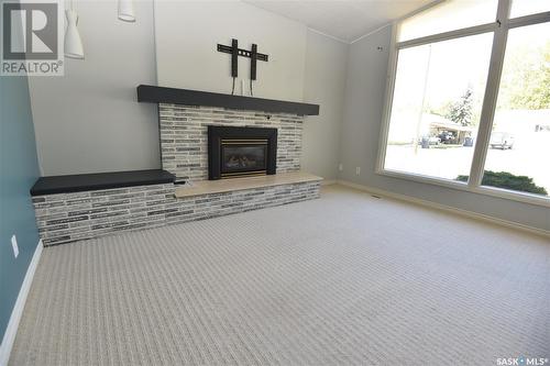 202 6Th Avenue E, Nipawin, SK - Indoor Photo Showing Other Room With Fireplace