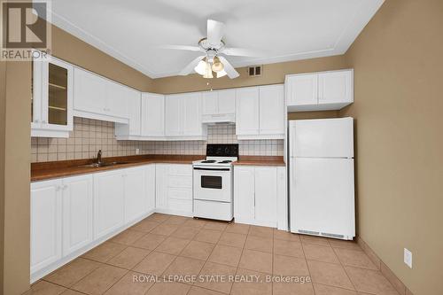 408 - 10 Woodman Drive S, Hamilton, ON - Indoor Photo Showing Kitchen With Double Sink