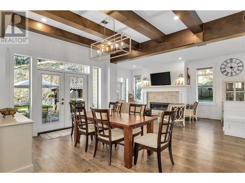 2191 Lavetta Drive, Kelowna, BC - Indoor Photo Showing Dining Room With Fireplace