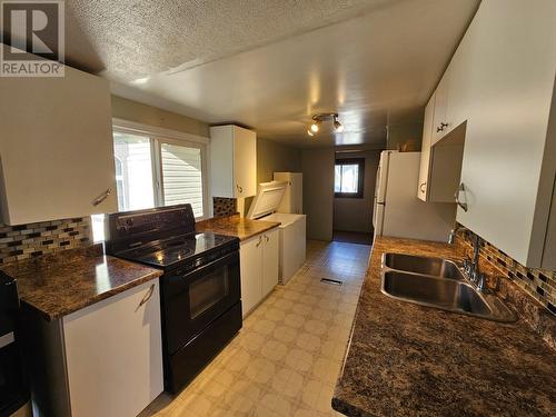 9916 Adams Street, Fort St. John, BC - Indoor Photo Showing Kitchen With Double Sink