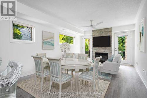 101 - 8 Brandy Lane Drive, Collingwood, ON - Indoor Photo Showing Dining Room With Fireplace