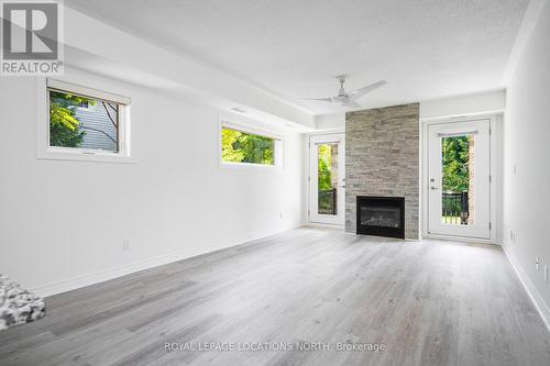 101 - 8 Brandy Lane Drive, Collingwood, ON - Indoor Photo Showing Living Room With Fireplace