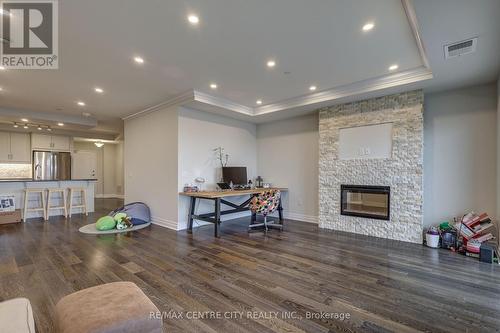 2402 - 505 Talbot Street, London, ON - Indoor Photo Showing Living Room With Fireplace