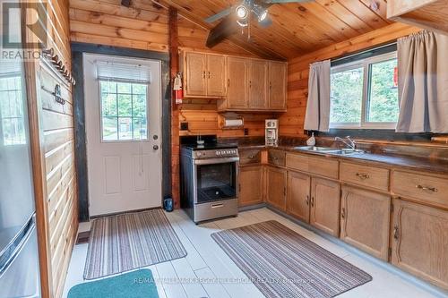 2514 Janes Lane, Severn, ON - Indoor Photo Showing Kitchen With Fireplace With Double Sink