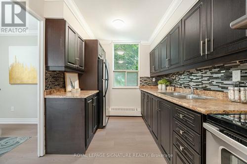 319 - 551 The West Mall, Toronto, ON - Indoor Photo Showing Kitchen With Double Sink