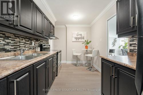 319 - 551 The West Mall, Toronto, ON - Indoor Photo Showing Kitchen With Double Sink