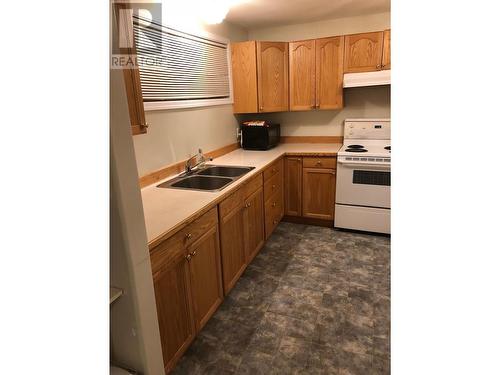 3928 Cottonwood Road, Fort Nelson, BC - Indoor Photo Showing Kitchen With Double Sink