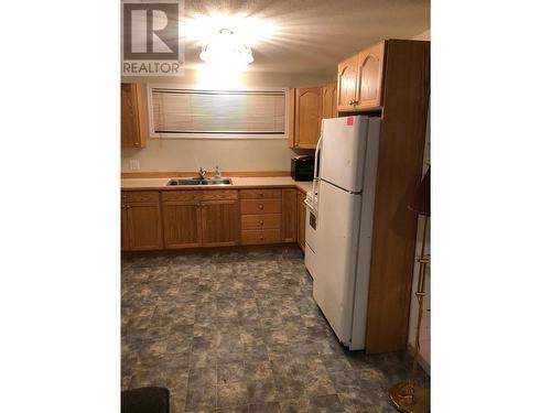 3928 Cottonwood Road, Fort Nelson, BC - Indoor Photo Showing Kitchen With Double Sink