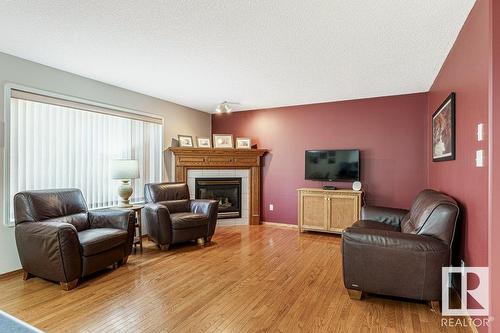 2944 41 Av Nw, Edmonton, AB - Indoor Photo Showing Living Room With Fireplace