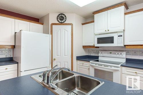 2944 41 Av Nw, Edmonton, AB - Indoor Photo Showing Kitchen With Double Sink