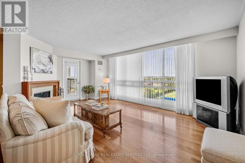 1402 - 2185 Marine Drive, Oakville, ON - Indoor Photo Showing Living Room With Fireplace