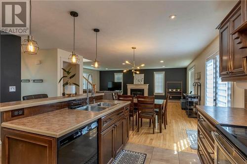 54 Mccoy Street, Moncton, NB - Indoor Photo Showing Kitchen With Fireplace With Double Sink