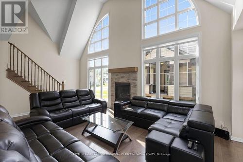 47 Marina Village Drive, Georgian Bay, ON - Indoor Photo Showing Living Room With Fireplace