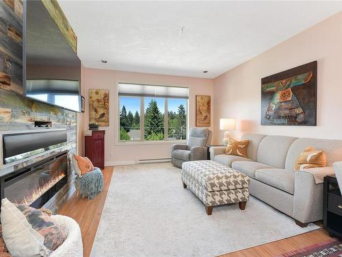 404-623 Treanor Ave, Langford, BC - Indoor Photo Showing Living Room With Fireplace