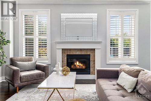 24 Greenpointe Drive, Ottawa, ON - Indoor Photo Showing Living Room With Fireplace