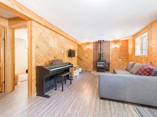 Salle de jeux - 27 Ch. De Maple Wood, Harrington, QC - Indoor Photo Showing Other Room With Fireplace